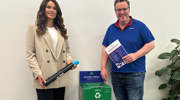 people-standing-beside-officeworks-recycling-box