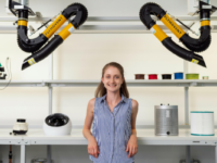 smiling-engineer-standing-in-laboratory