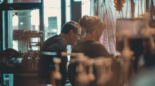 Cafe owners working in a cafe.