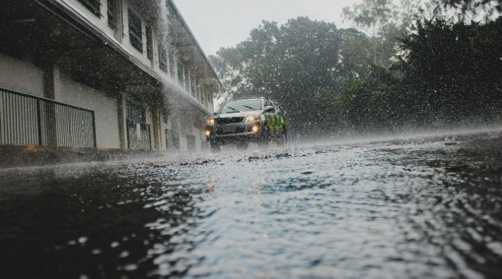 Car driving in heavy rain.